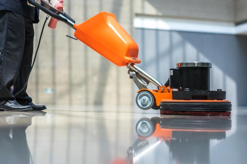 Person is Using a Machine to Clean a Floor — Capital Ultimate Facility in Beard, ACT