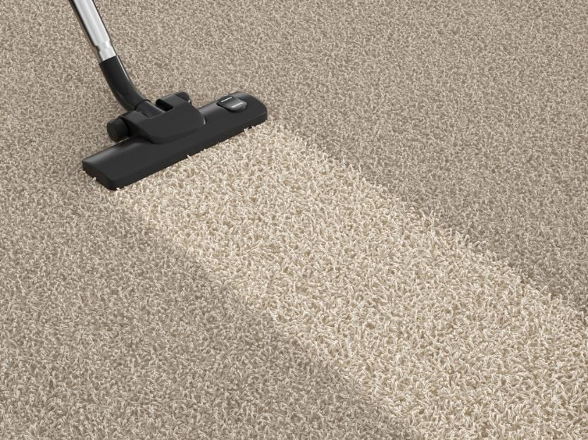 Vacuum Cleaner is Cleaning a Beige Carpet — Capital Ultimate Facility in Beard, ACT