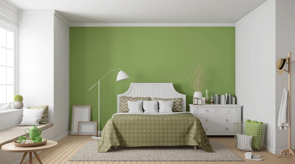 Bedroom With Green Walls and a White Bed — Capital Ultimate Facility in Canberra, ACT
