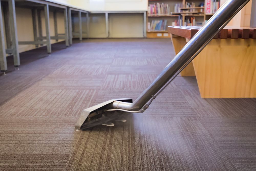 Vacuum Cleaner is Cleaning a Carpeted Floor in a Library — Capital Ultimate Facility in Belconnen, ACT