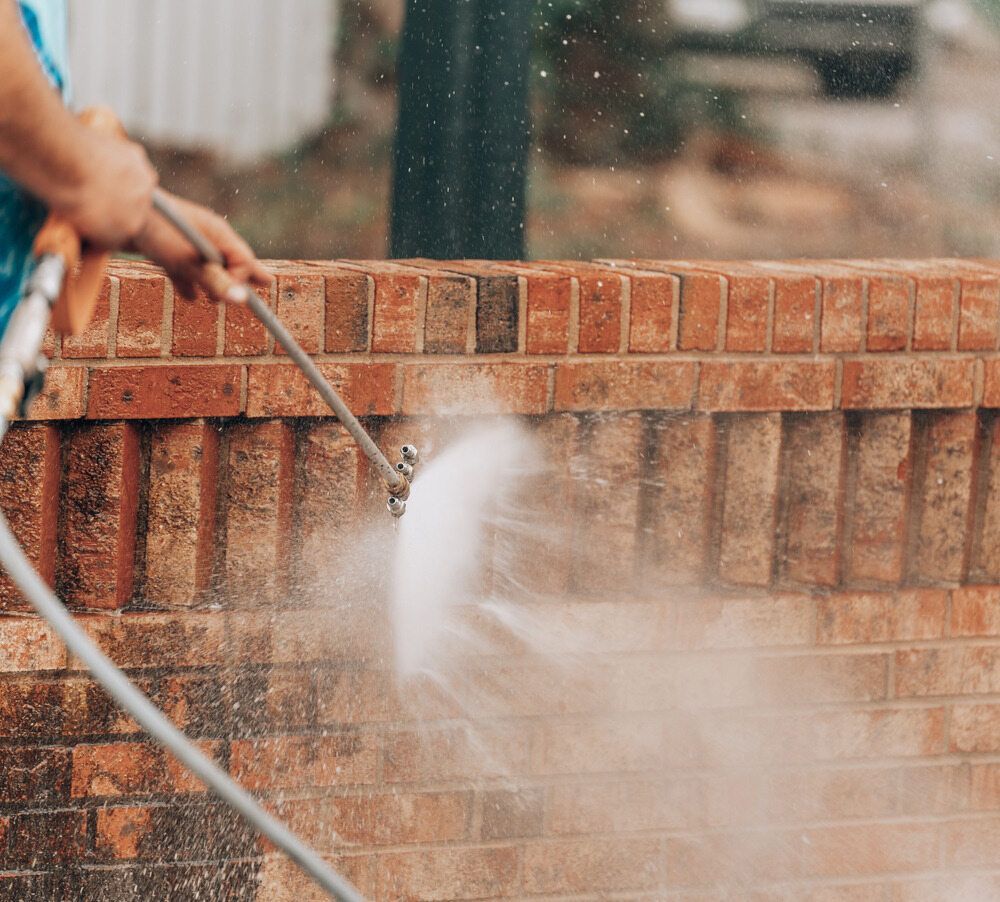 A person is pouring paint into a paint tray — Capital Ultimate Facility in Beard, ACT
