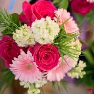 Pink and white mixed bouquet with roses, gerbera daisies, and small white blossoms