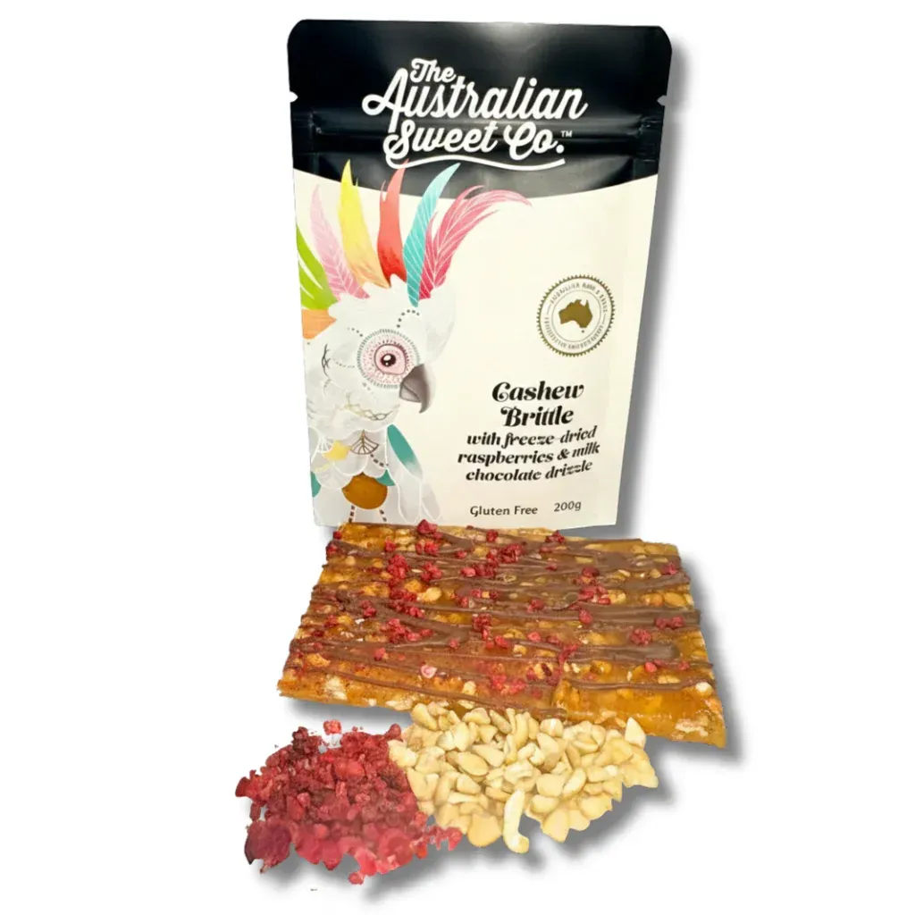 Australian Jewel Tea package with colorful tea leaves and dried fruit pieces on a white background