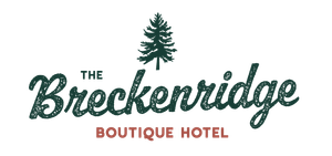 The breckenridge boutique hotel logo has a pine tree on it.