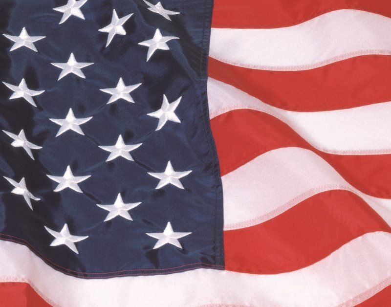 American flag waving with stars and stripes.