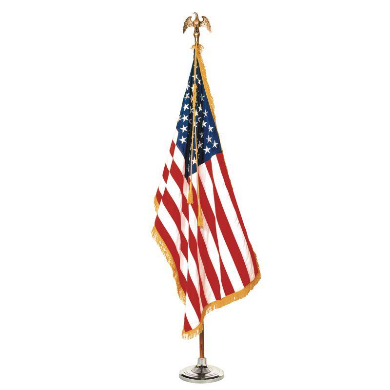 American flag displayed on a stand with an eagle topper.