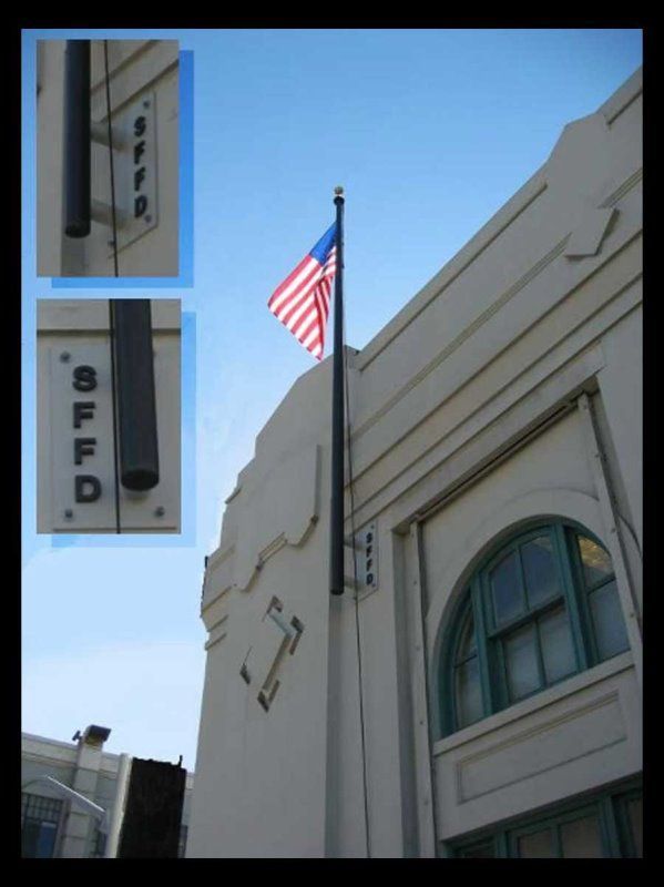 American flag flying on a pole attached to a building with 