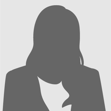 Silhouette of a person in a blazer and blouse, shown from the shoulders up against a light background