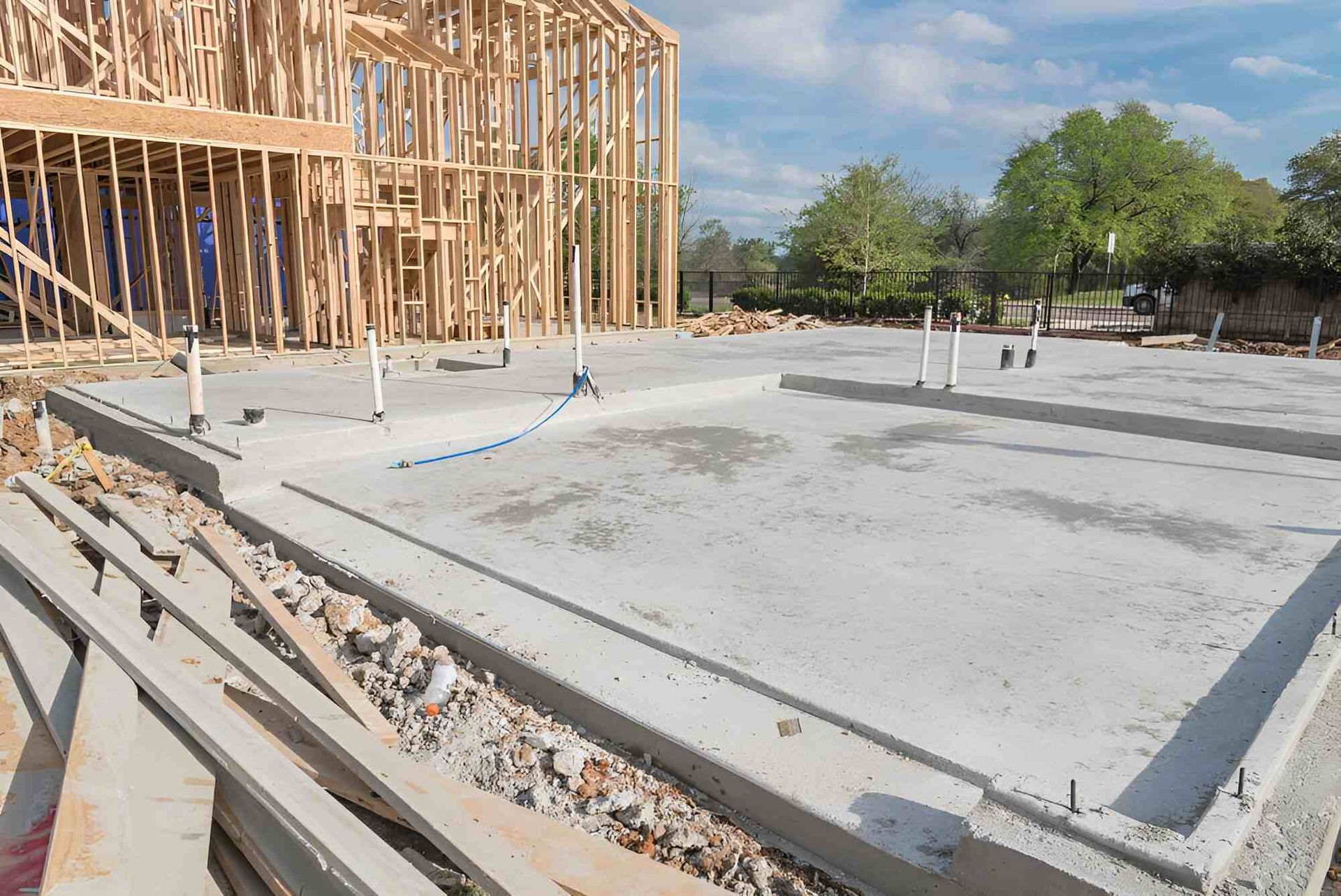 A House Is Being Built With A Concrete Foundation And A Wooden Frame — Affordable Underpinning Solutions In Parramatta, NSW