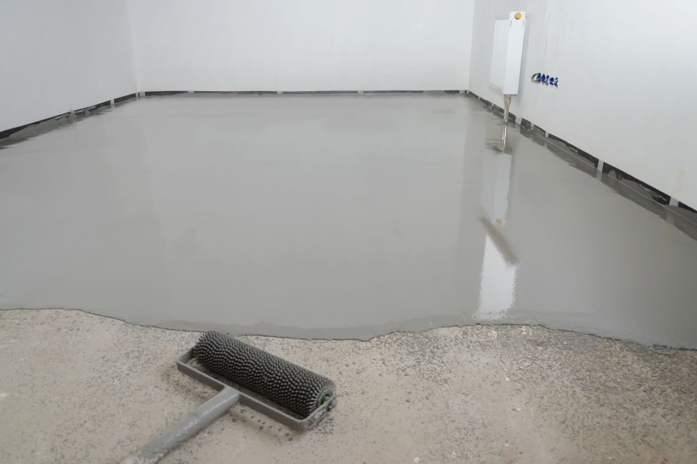 A Roller Is Sitting On The Floor Of A Room — Affordable Underpinning Solutions In Shell Cove, NSW