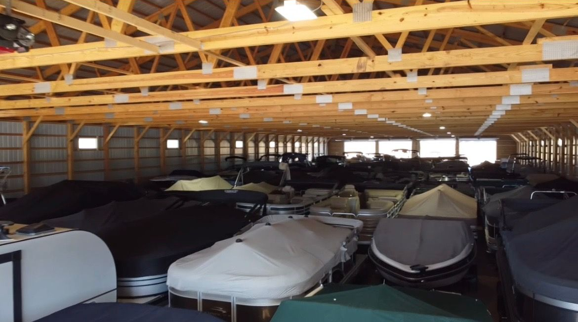 Great Outdoors barge crew on Minnesota lake with dock materials