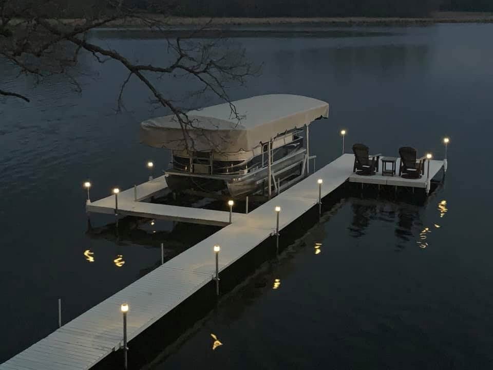 Great Outdoors barge crew on Minnesota lake with dock materials