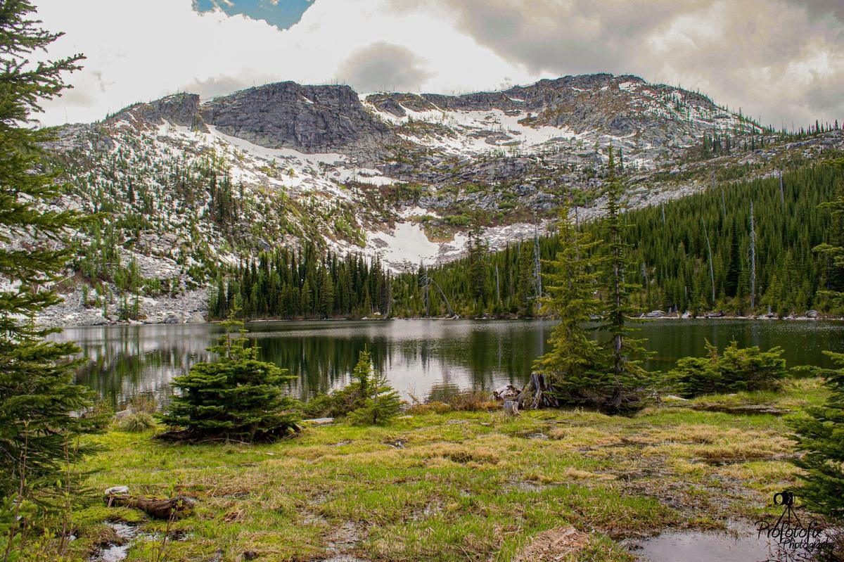 Roman Nose Lake reflecting the surrounding Selkirk peaks, near Naples, Idaho