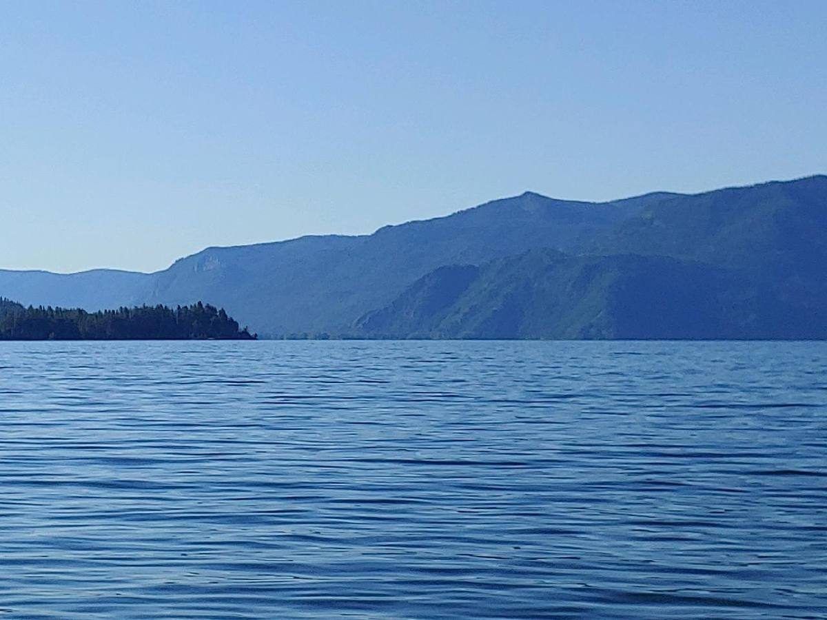 Calm blue water and forested ridgelines of Lake Pend Oreille