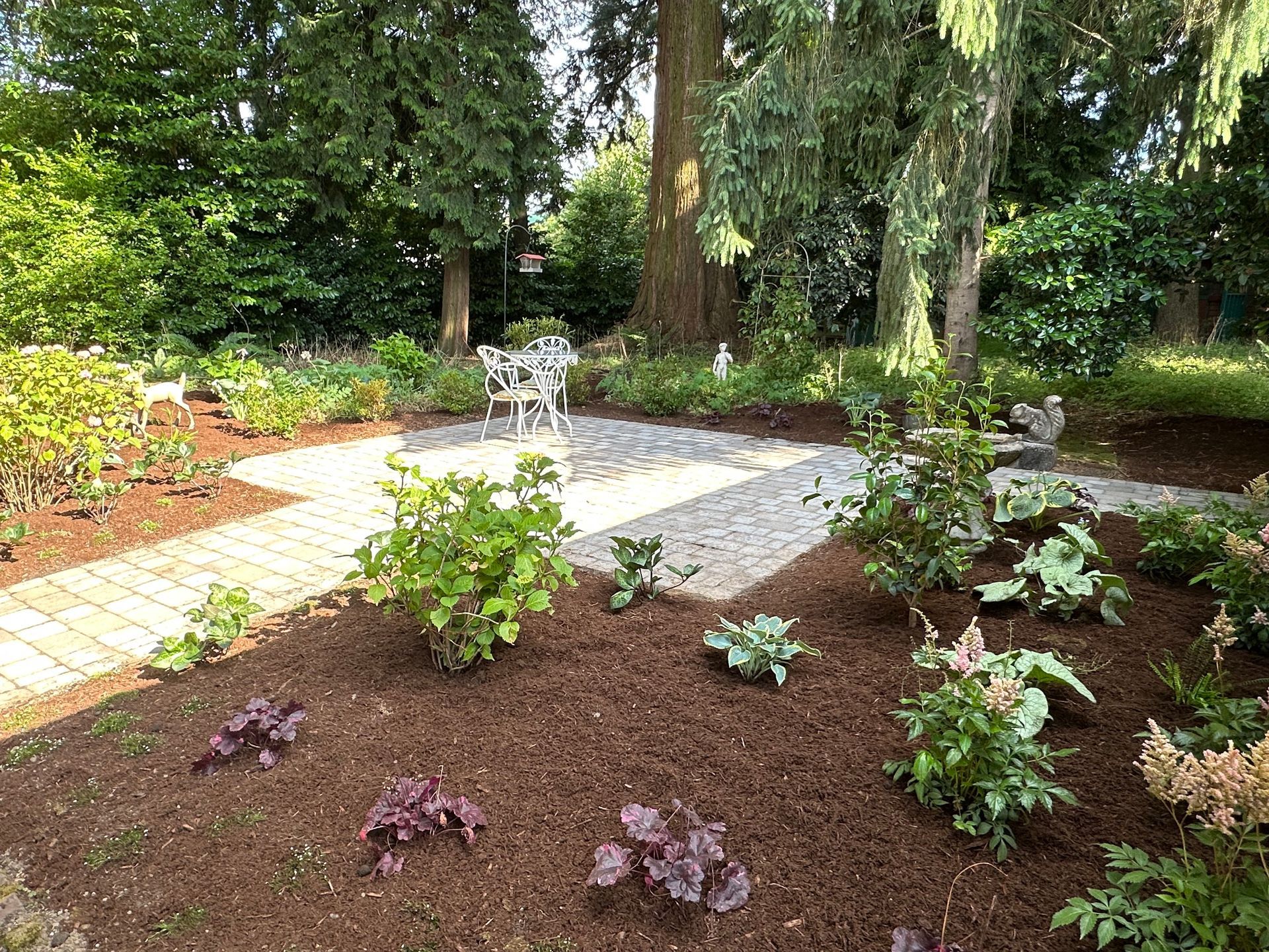 backyard paver patio woodland plants purple pink peach flowers vintage