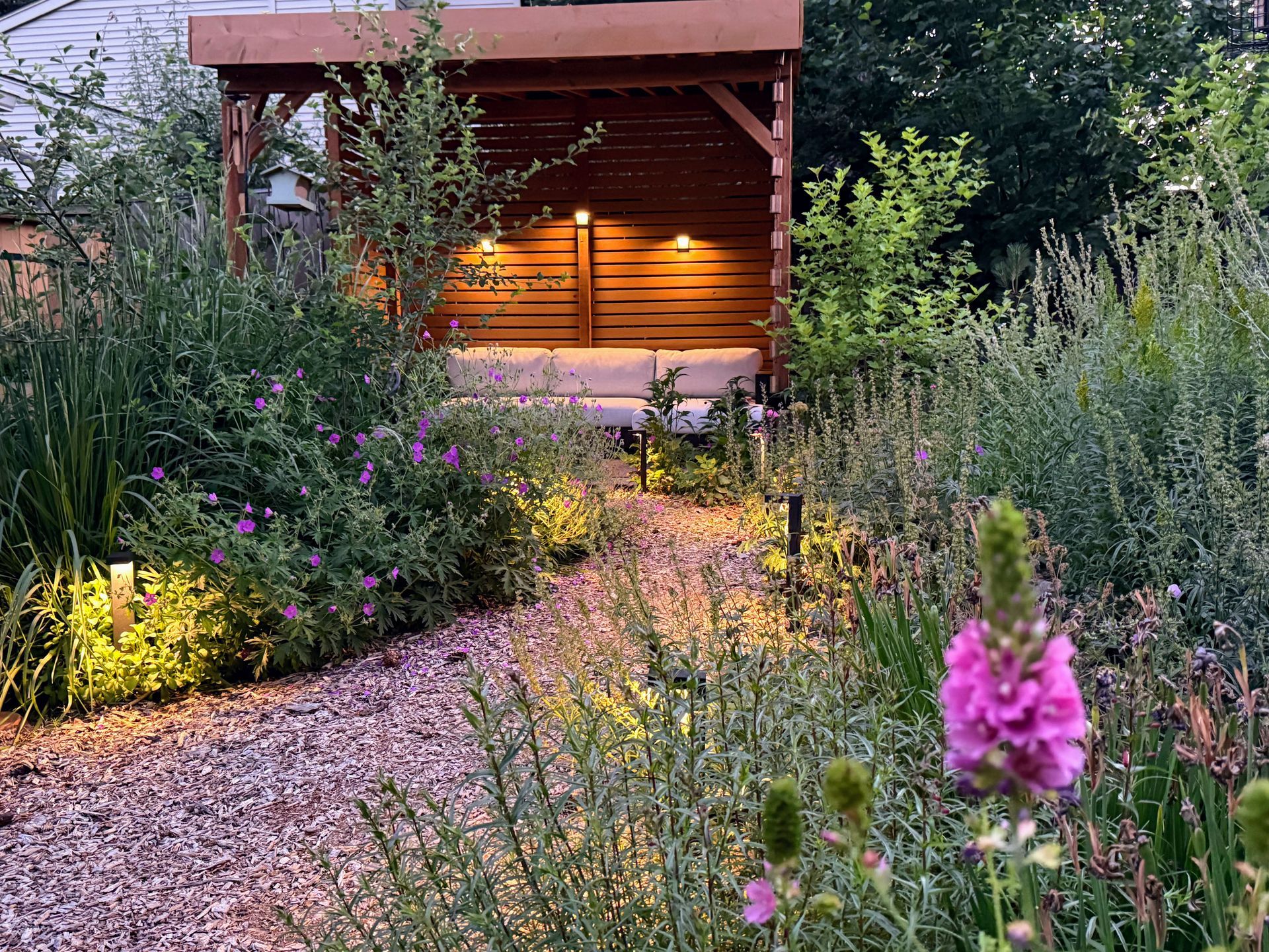 green roof with shady sit spot surrounded by native plants and wildlife friendly landscape lighting