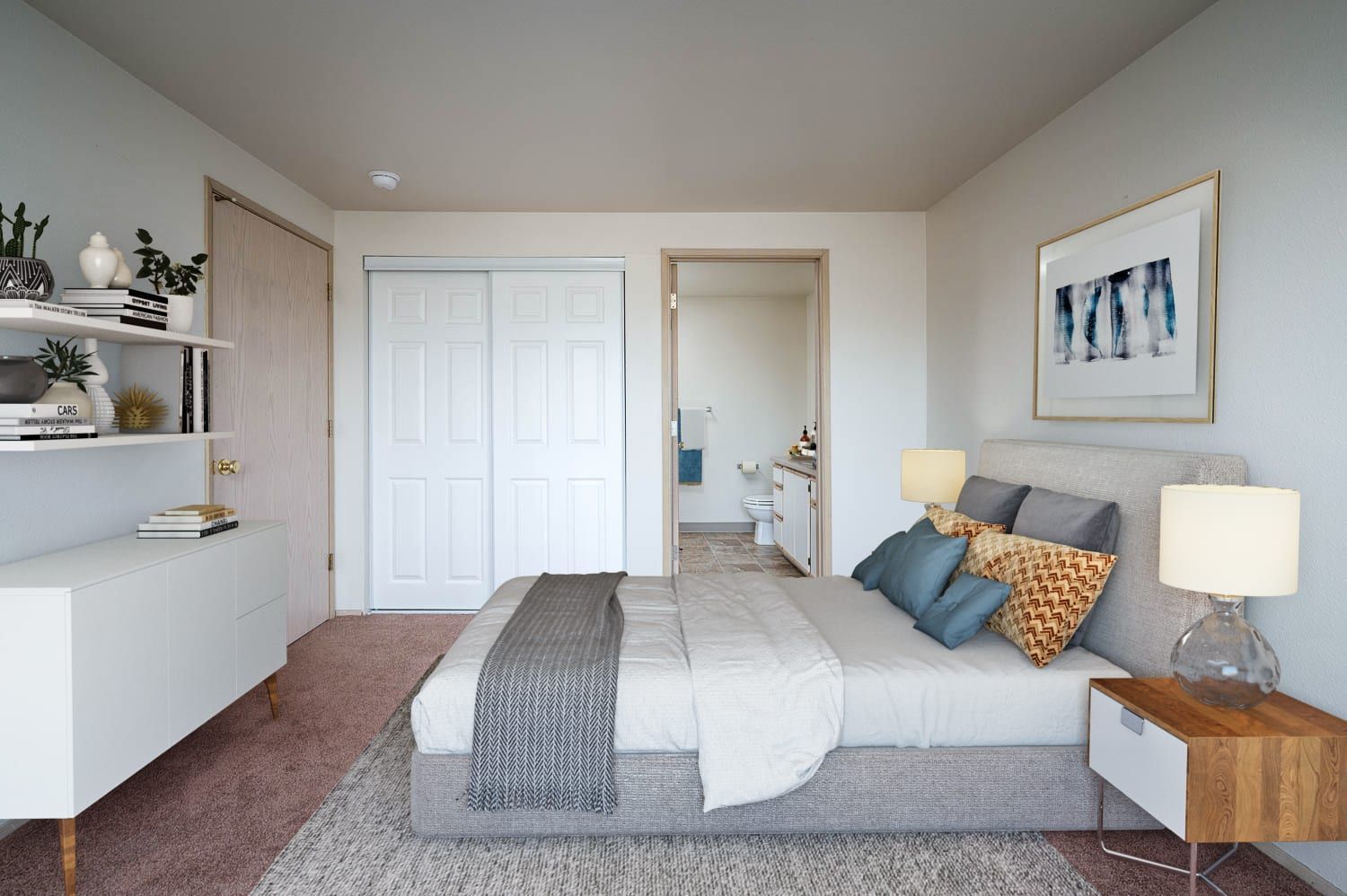 Bedroom with bed, nightstand, and closet. Light colors dominate with a glimpse of a bathroom.