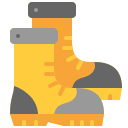 Yellow rain boots with gray cuffs and orange reflections on a white background