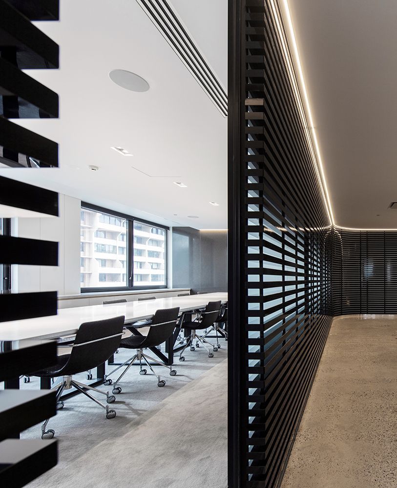Modern Conference Room With Black Slat Wall, Long White Table, Black Chairs — Affordable Tiles and Pavers In Morisset, NSW