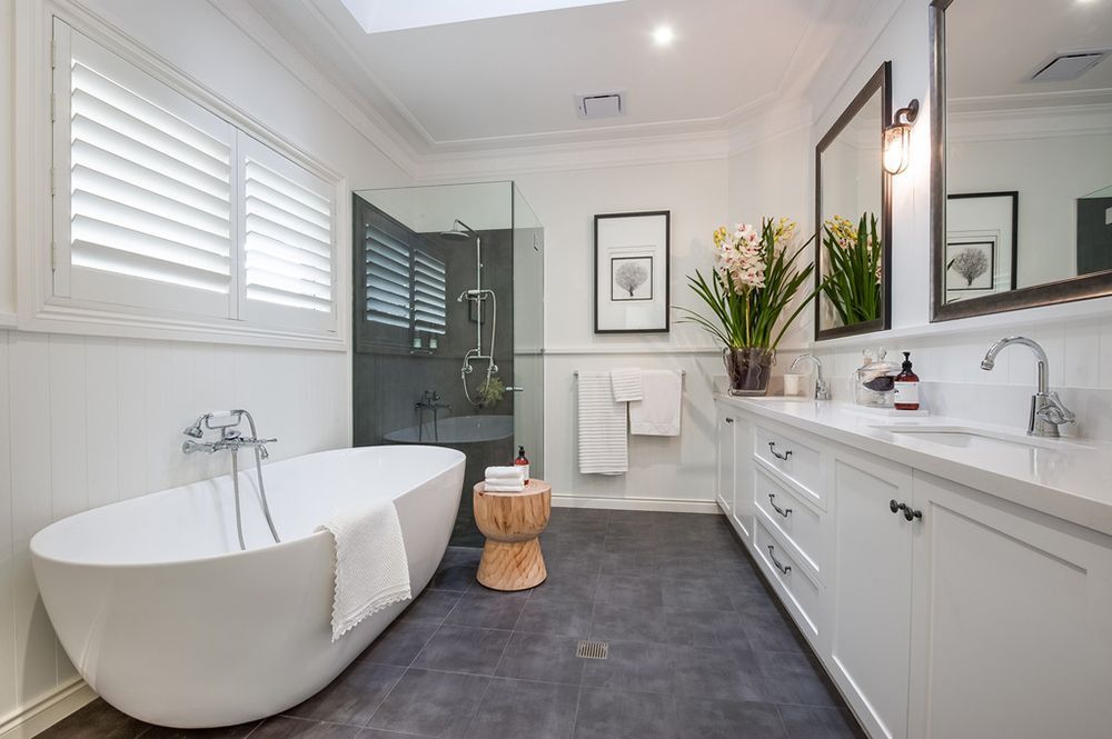 Modern White Bathroom With a Freestanding Tub, Large Vanity, and Shower — Affordable Tiles and Pavers In Morisset, NSW