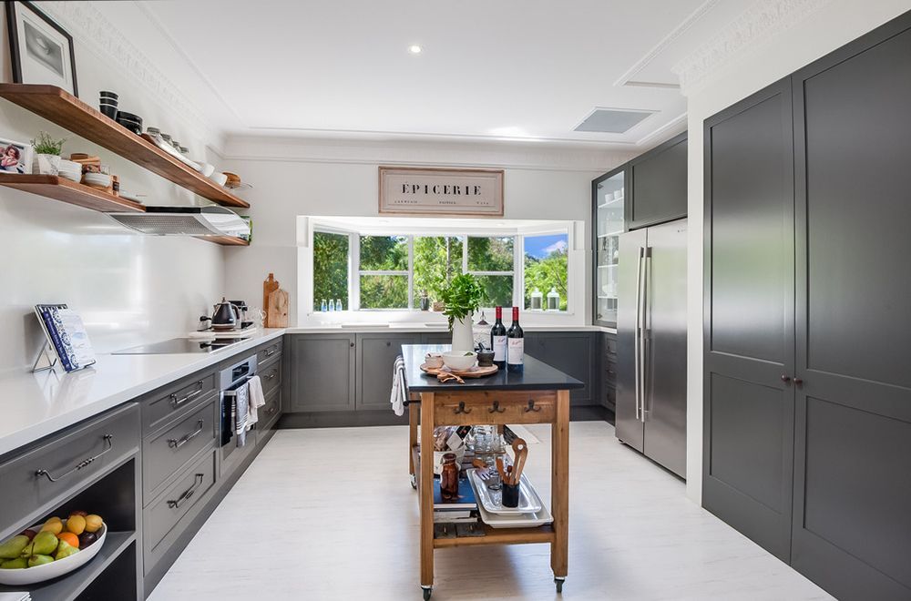 Gray and White Kitchen With Island, Refrigerator, and Large Window — Affordable Tiles and Pavers In Morisset, NSW