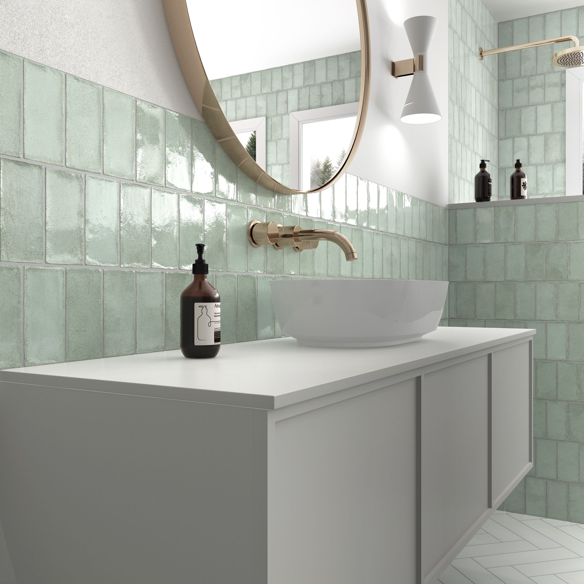 Modern bathroom with mint tile walls, round mirror, white vanity, vessel sink, and bronze faucet.