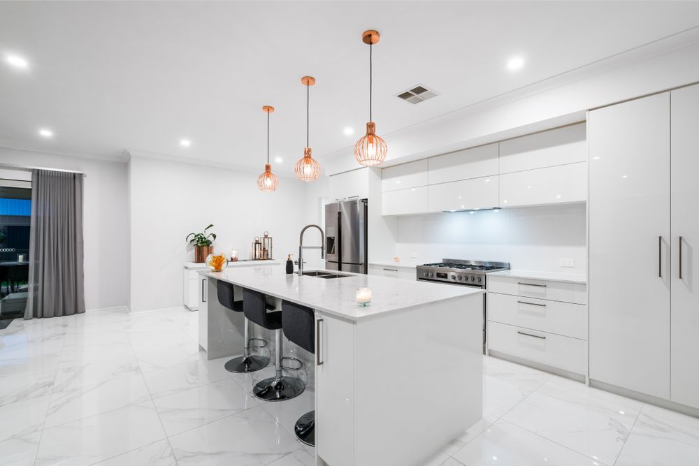 Modern White Kitchen With Island — Affordable Tiles and Pavers In Newcastle, NSW