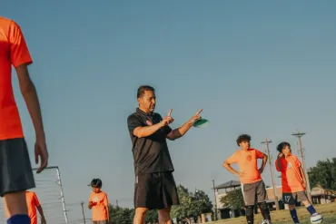 Dutch FC coach leading youth soccer training session