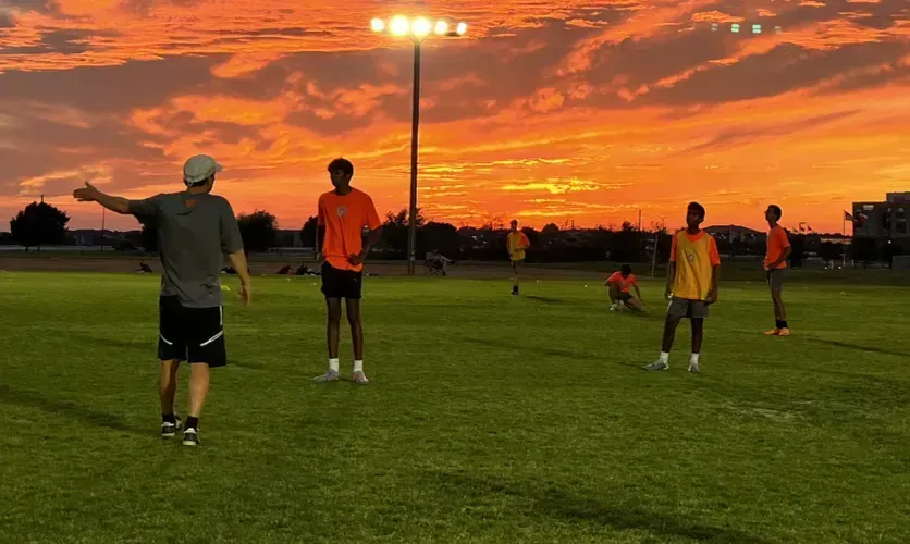 parent watching youth soccer