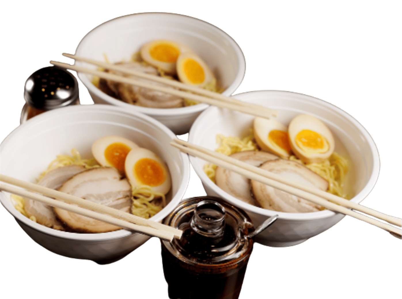 Bowls of ramen with chopsticks and soy sauce bottles