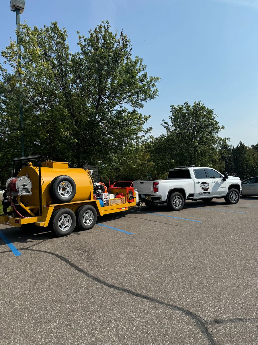 Two trucks are parked next to each other in a parking lot.