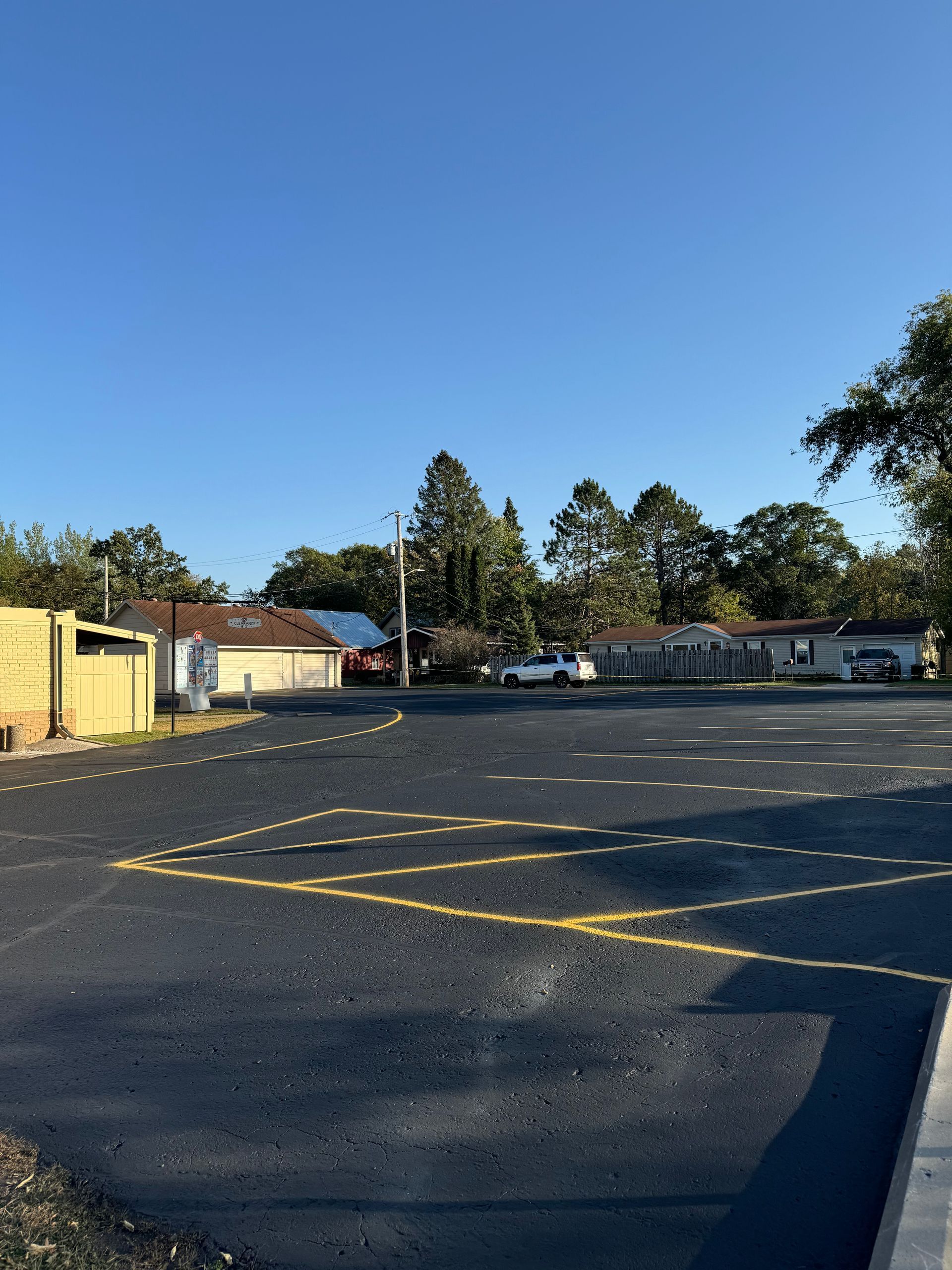 A parking lot with a blue sky in the background