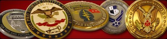 Challenge Coins from Awards Canada lined up on a red surface