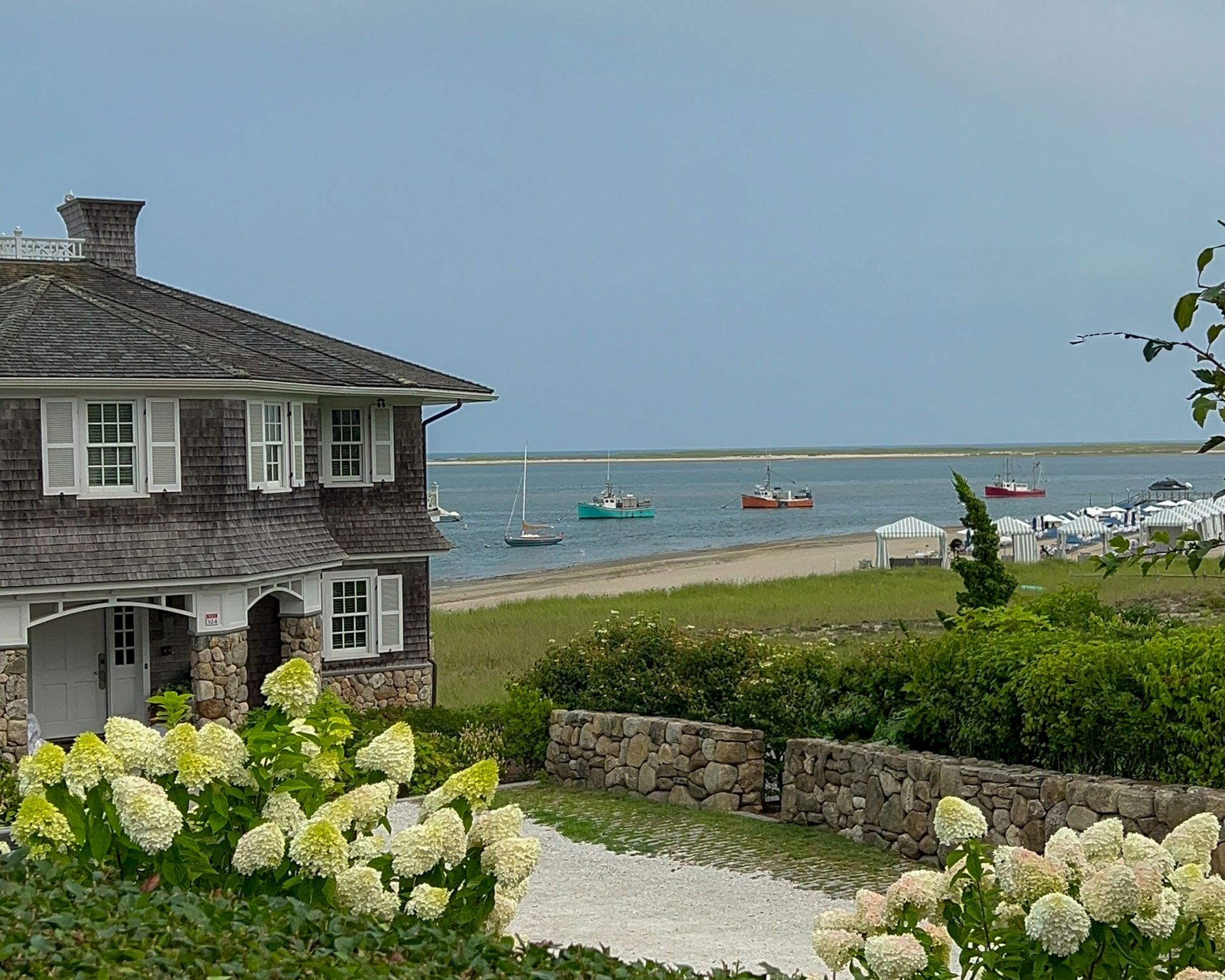 A house with a view of the ocean and boats