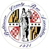 The seal of baltimore county shows a woman standing in a circle with a shield.
