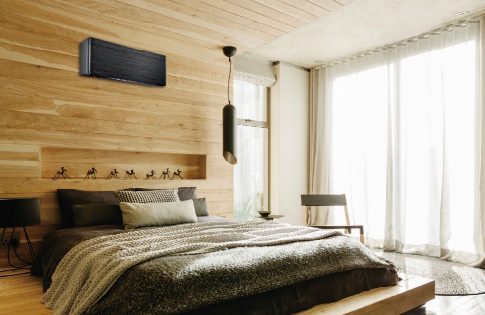 Bedroom with wood paneling, a bed, air conditioner, and large windows — L & K Electrical & Air Conditioning in Tamworth, NSW