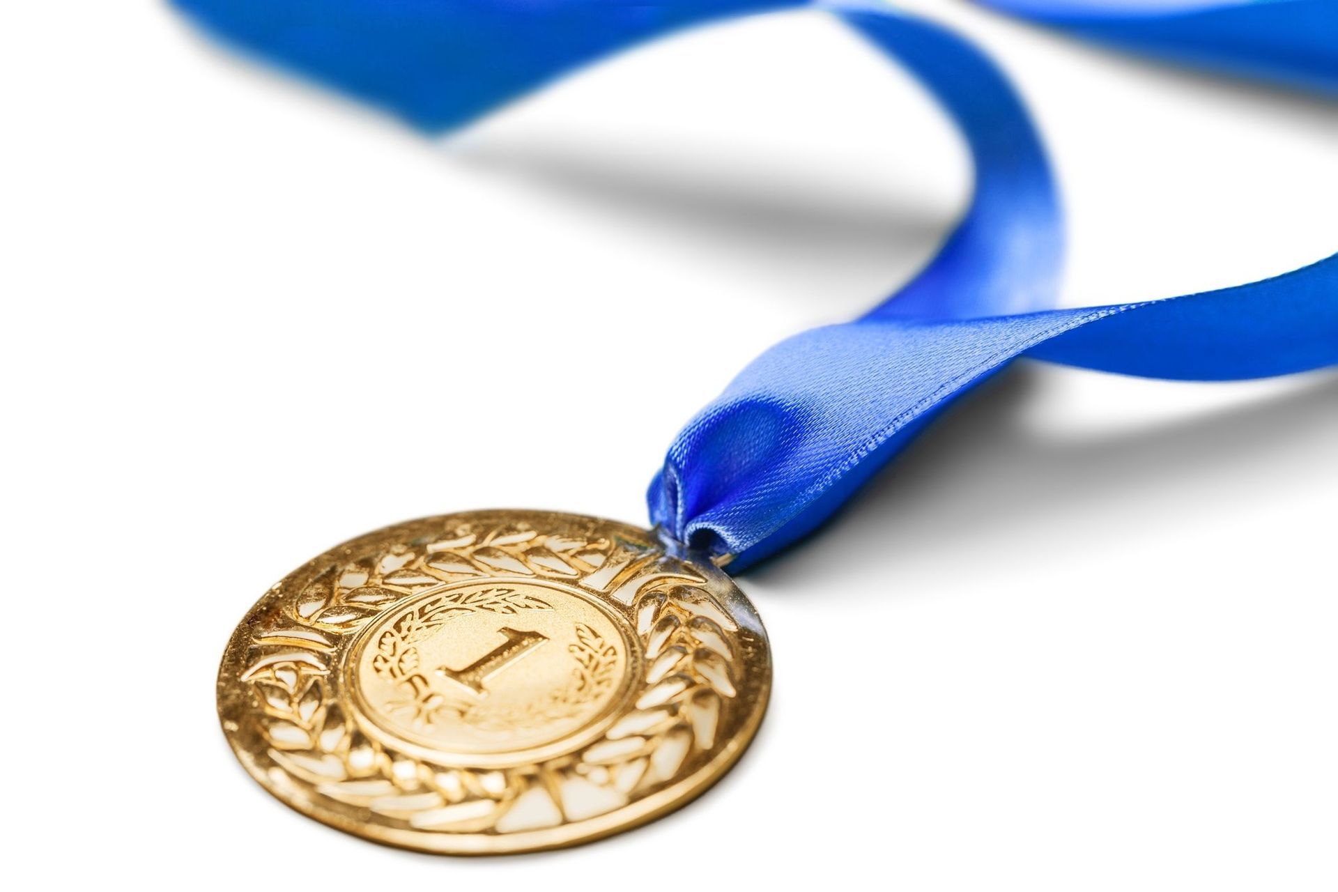 A gold medal with the number 1 on it