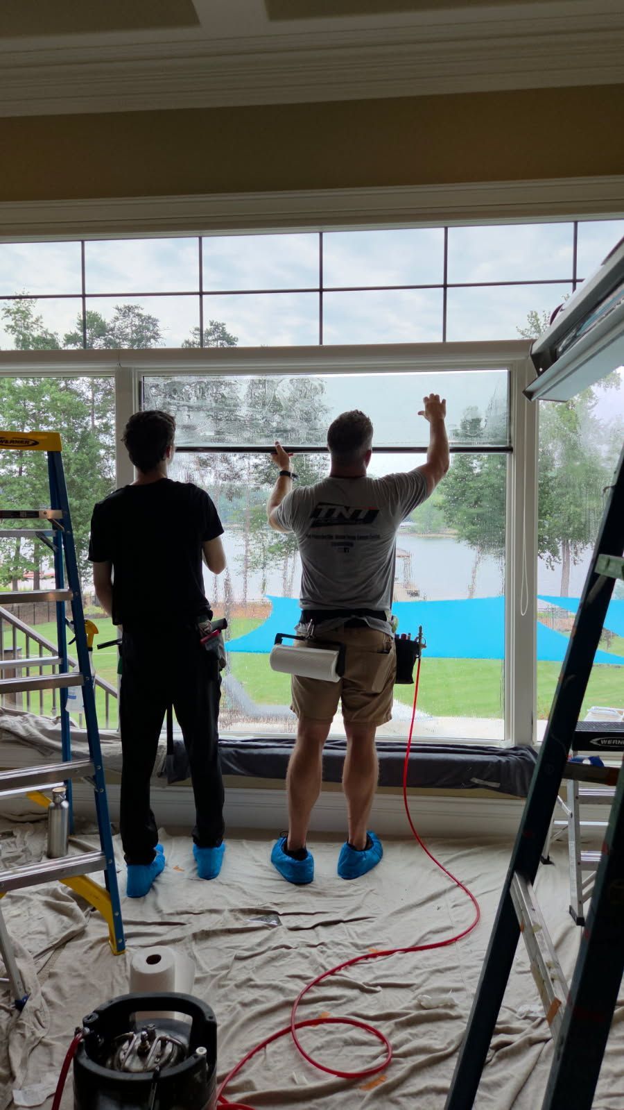 A porch is being painted in a house.
