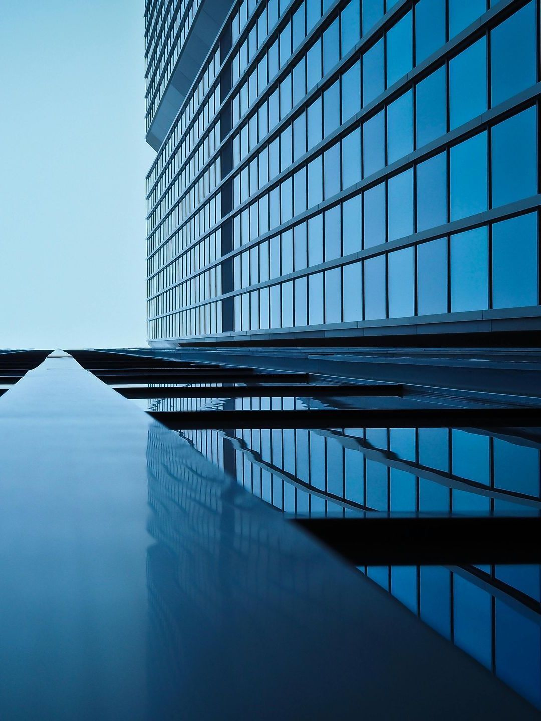 Looking up at a tall building with lots of windows
