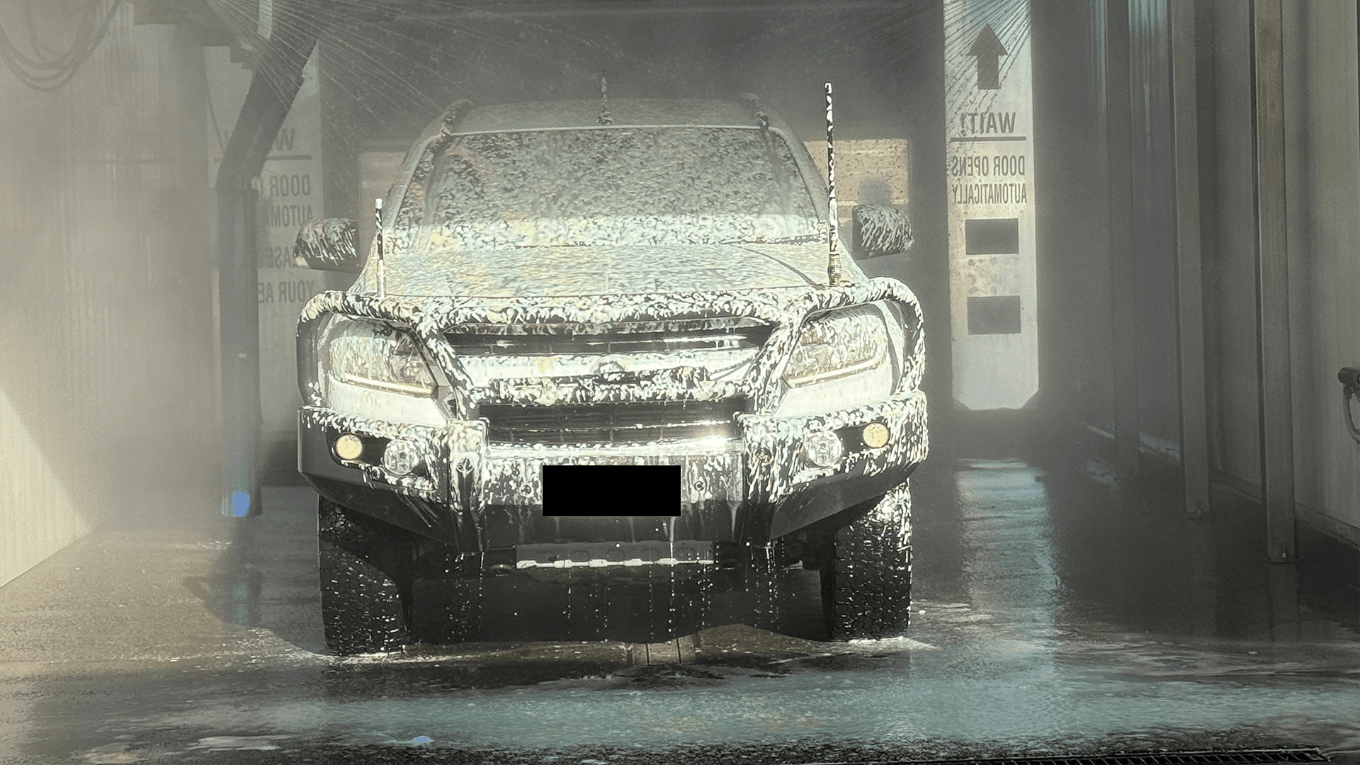 A Person Is Cleaning The Dashboard Of A Car With A Cloth — Carwash On Canning In Allenstown, QLD