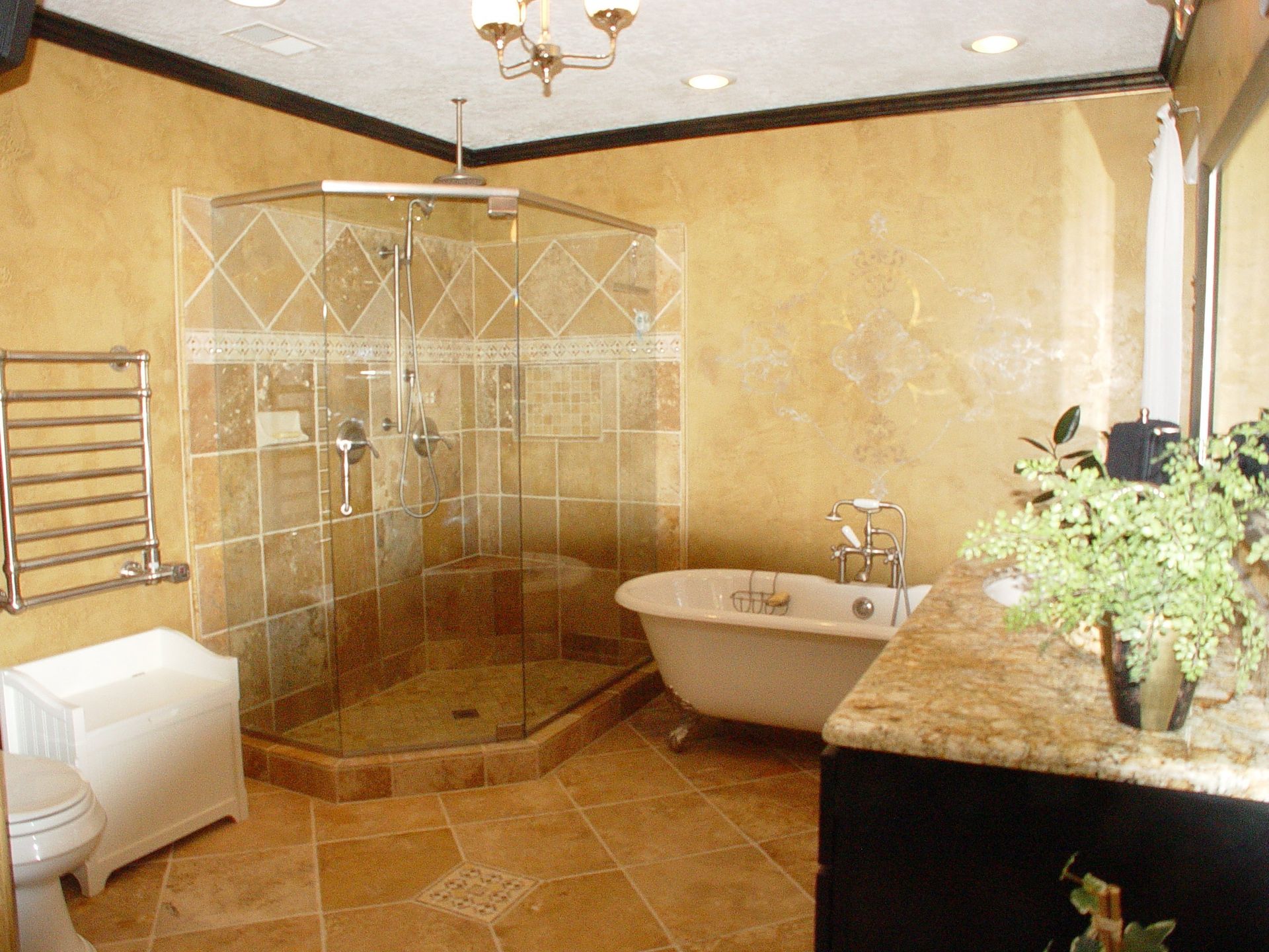 A bathroom with a claw foot tub and a walk in shower