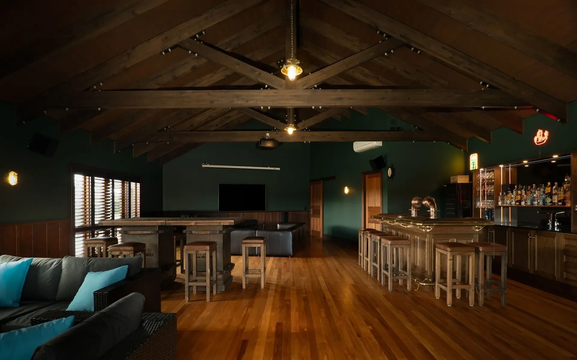 A large room with a bar and a couch