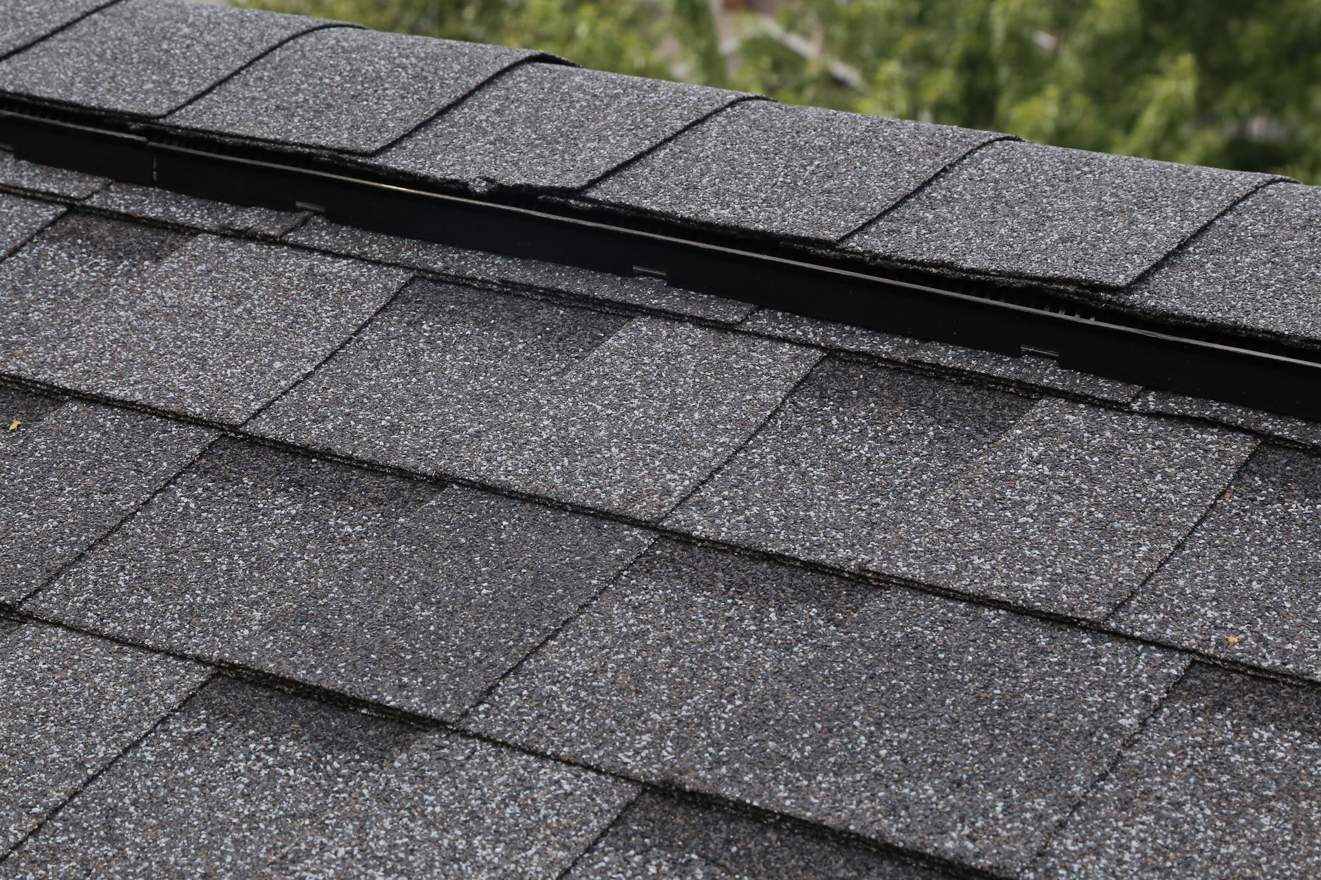 Top peak of a slanted roof.