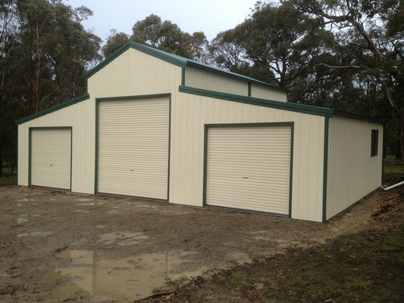 A Large White Building with Green Trim - Wallan, VIC - Victorian Garages & Barns