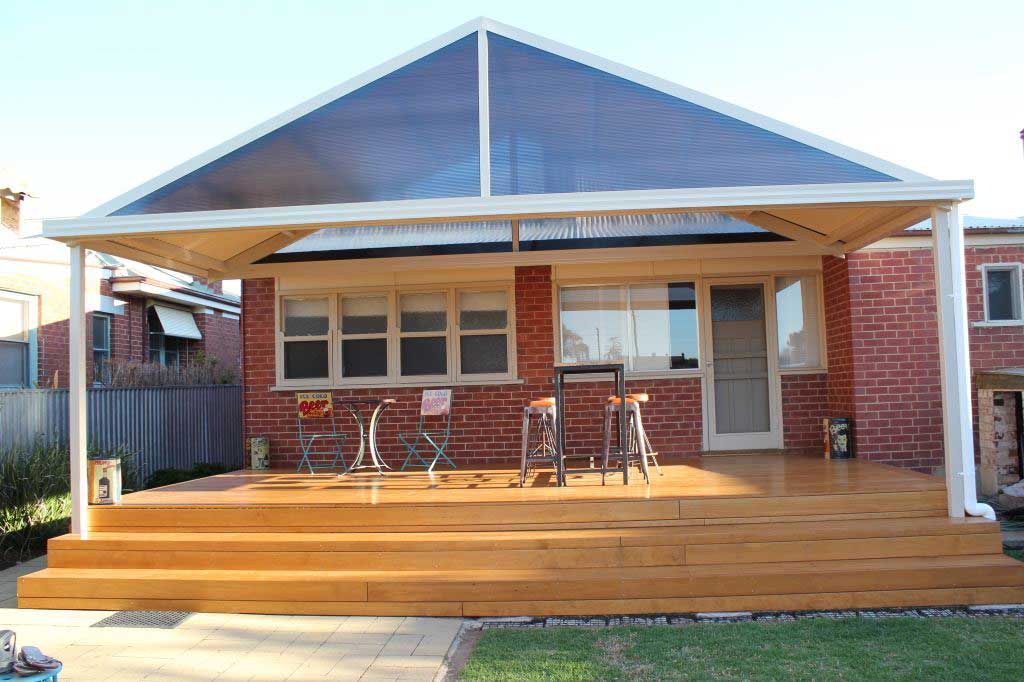 A Brick House with Patio and a Wooden Deck and a Clear Roof - Wallan, VIC - Victorian Garages & Barns