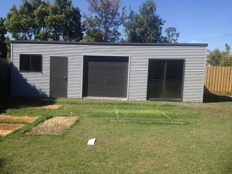 A Garage with a Black Door - Wallan, VIC - Victorian Garages & Barns