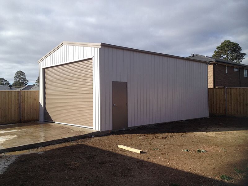 A White Garage with a Brown Door - Wallan, VIC - Victorian Garages & Barns