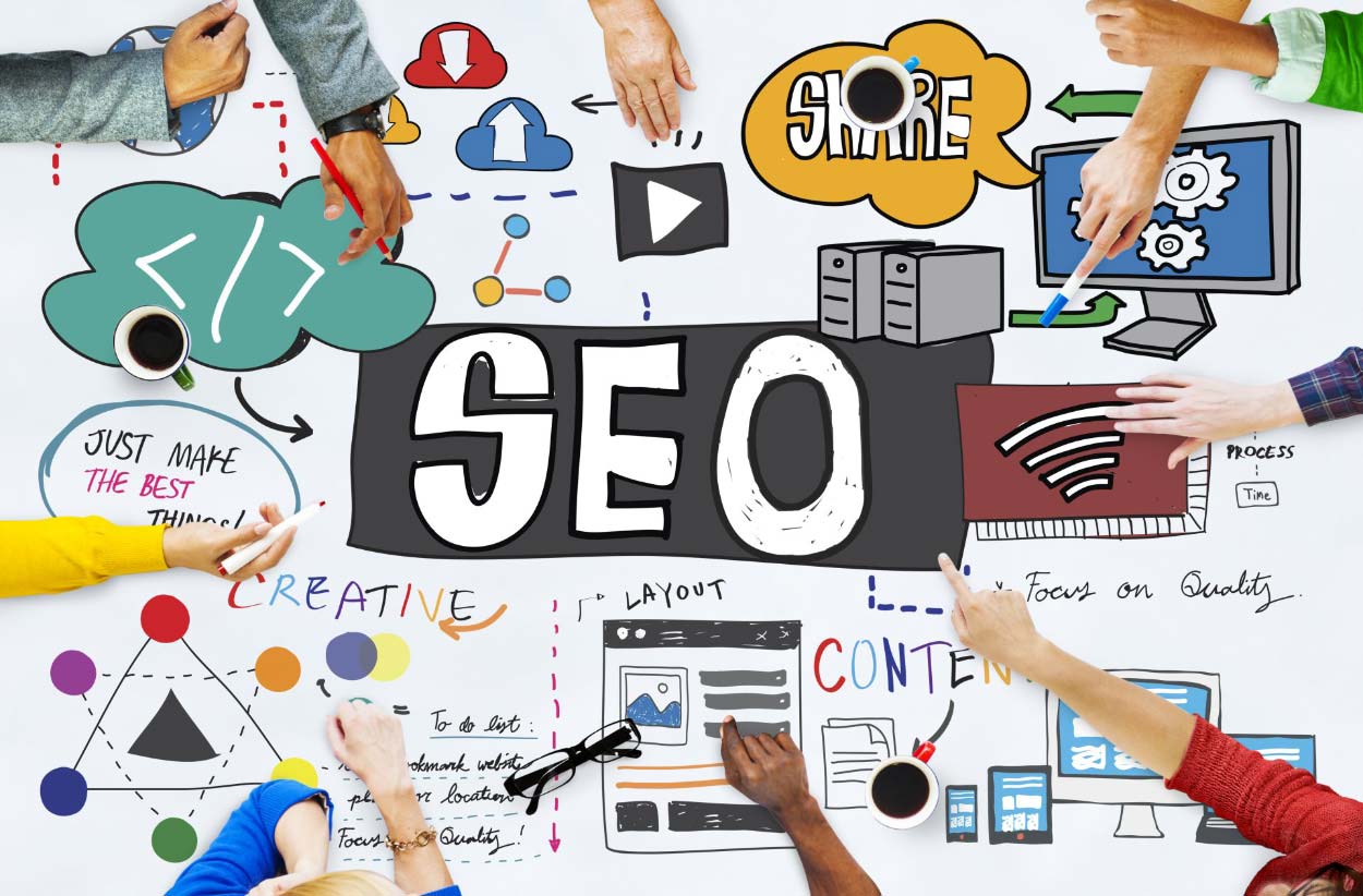 A group of people are sitting around a table working on seo.