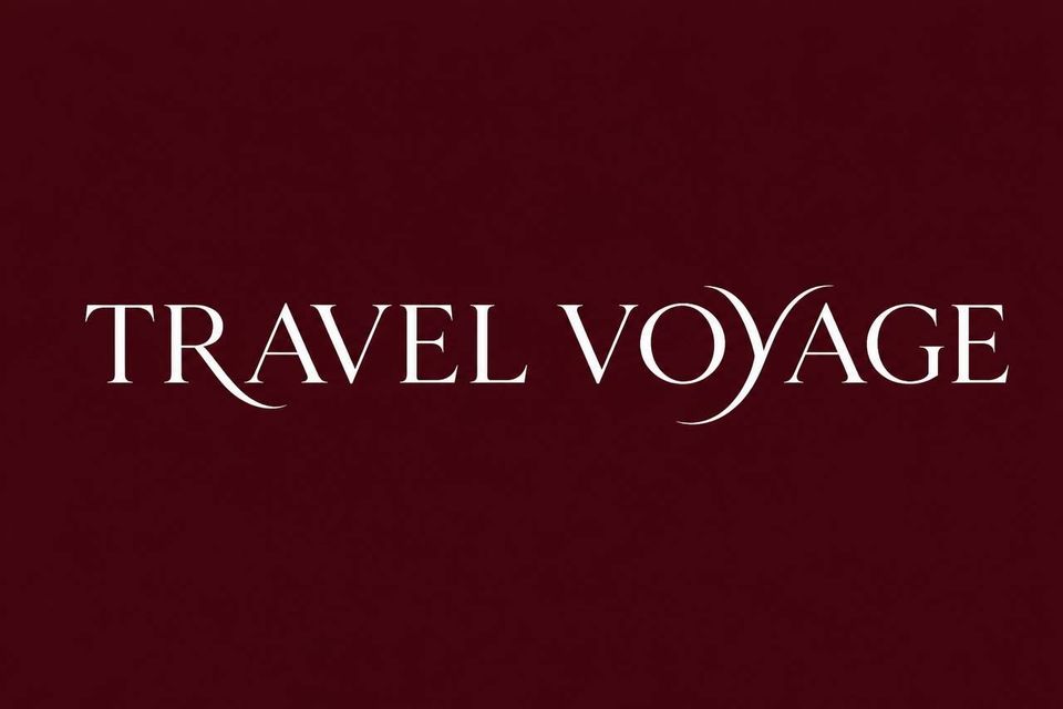 Travel Voyage text in white serif letters on a dark maroon background
