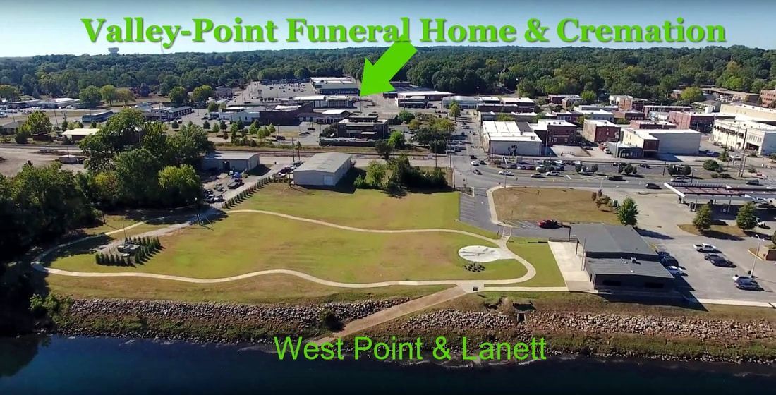Aerial view of West Point and Lanett, Alabama, with Valley-Point Funeral Home & Cremation indicated by a green arrow.